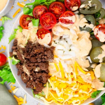 overhead view of cheeseburger bowl with prepped ingredients