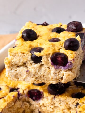 serving a piece of Blueberry cottage cheese breakfast bake from the casserole dish