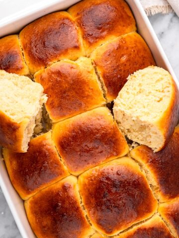 gluten free hawaiian bread rolls in a casserole dish after being baked